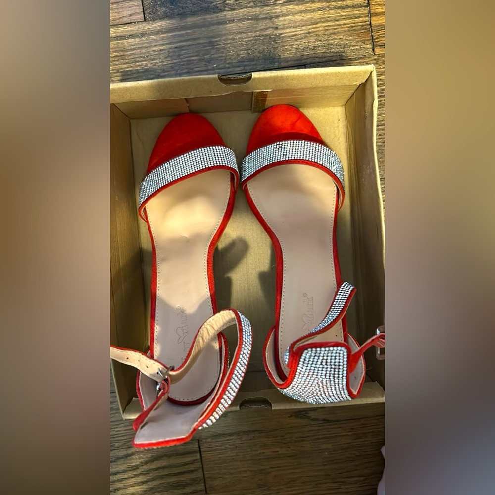 Absolutely gorgeous pair of red suede diamond high heels, never worn NWT!